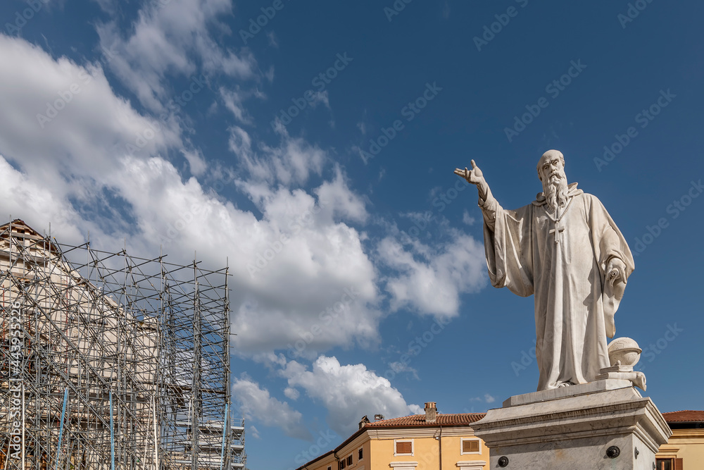 Fototapeta premium The statue of San Benedetto in the homonymous square, Norcia, Italy