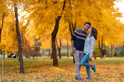Mixed race couple standing in an autumn park © Collab Media