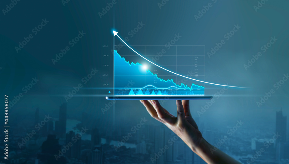 Businessman holding tablet and display graphs growth of business on virtual interface and stock market statistics gain profits on blue background. - obrazy, fototapety, plakaty 