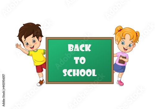 Cartoon kids back to school standing behind blackboard