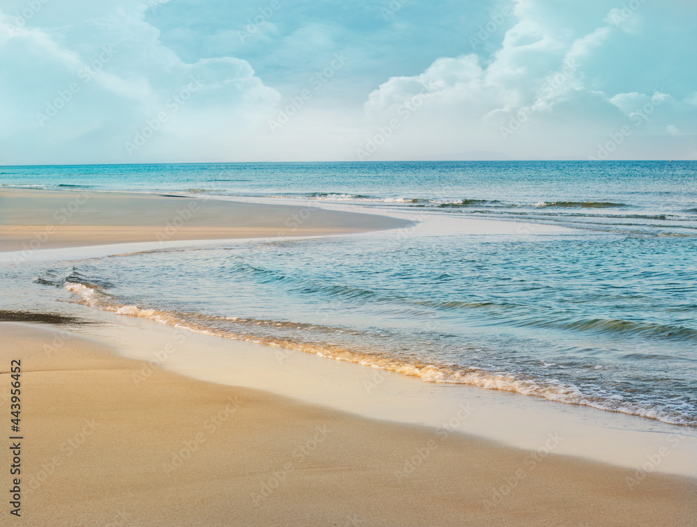 Tropical beach with golden sand, Relaxing vacation, Turquoise sea against blue sky on sunny summer day background. Tropical beach with golden sand, Relaxing vacation, Turquoise sea against blue sky on sunny summer day background.