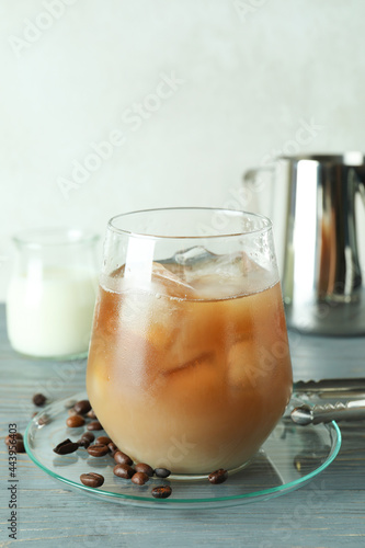 Concept of cold drink with ice coffee on wooden table