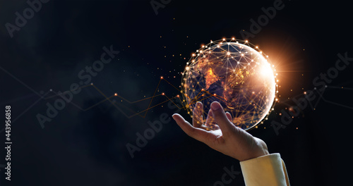 Cuadro en lienzo .Businessman holding night earth and global networking connection and data excha