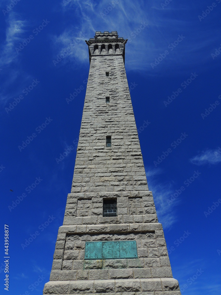 pilgrims' monument next to cape cod bay on a sunny spring day  in provincetown, massachusetts