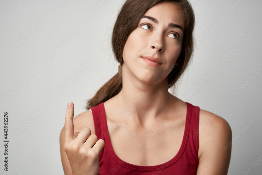 woman with injured forefinger injury medicine light background woman with injured forefinger injury medicine light background