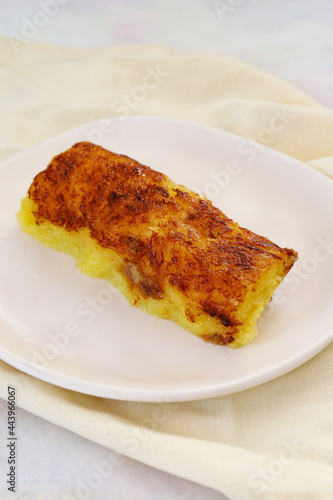 cheese dessert on a white wooden background. Local name peynir tatlisi