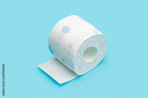 Roll of toilet paper on blue background