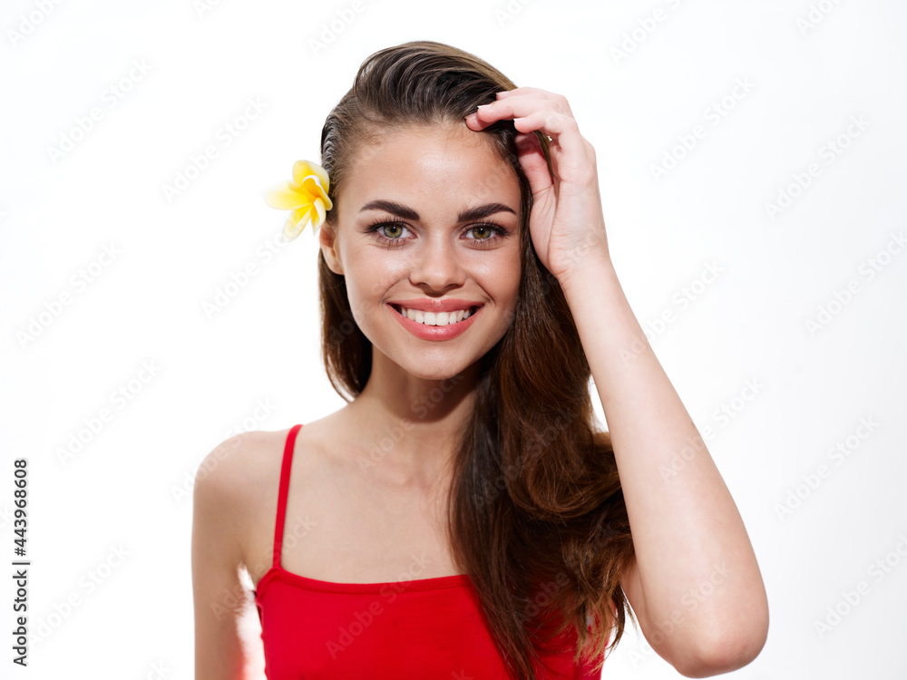 attractive brunette woman with flower in her hair and red t-shirt model attractive brunette woman with flower in her hair and red t-shirt model
