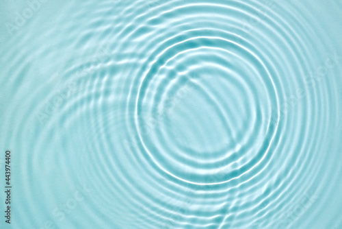 Blue water texture  blue mint water surface with rings and ripples. Spa concept background. Flat lay  copy space.