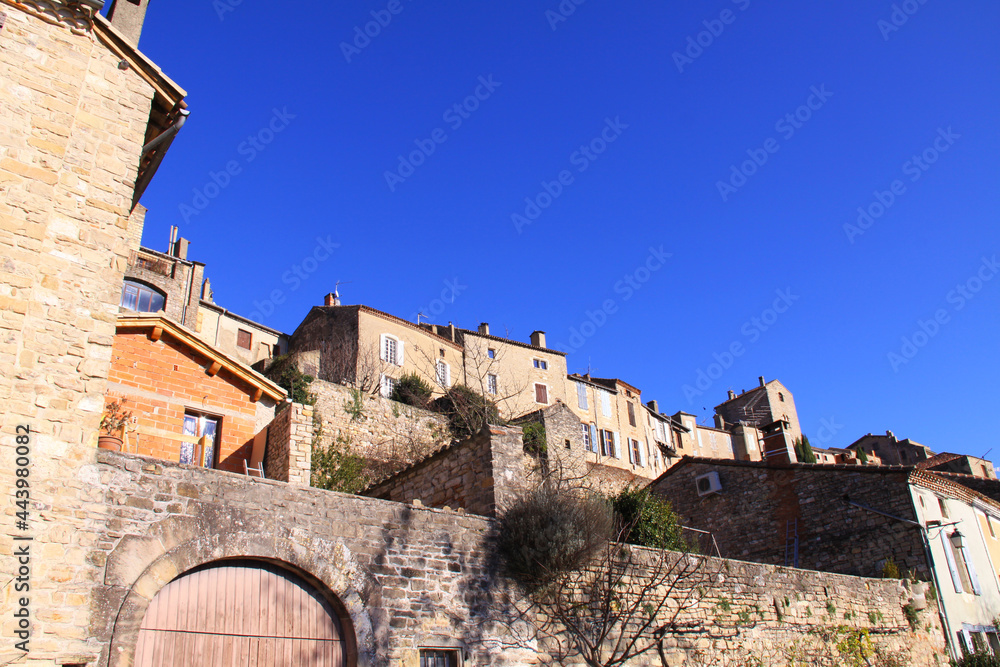 Stone houses in a medieval town in southern France on a clear day