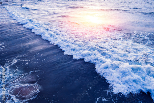 Big wave blue water with sunset sea amazing nature background Aerial top view. Turquoise of ocean at sunny day © Parilov