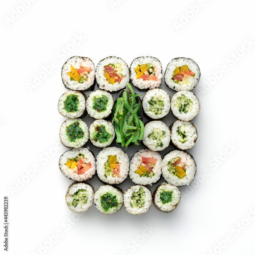 Sushi and Sashimi Set, nori maki rolls with green seaweed isolated on white background. Classic Japanese food. Healthy Oriental meal. Wellness concept. Flat lay. Top view. Copy space.