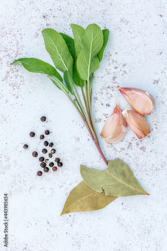 Фотография A brining solution comprising bay leaves, sage, garlic, peppercorns, honey, suit