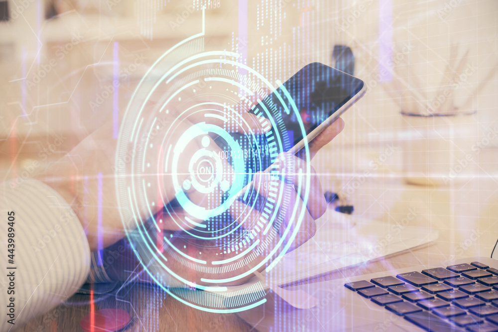 Double exposure of man's hand holding and using a digital device and data theme hologram drawing. Technology concept. Double exposure of man's hand holding and using a digital device and data theme hologram drawing. Technology concept.