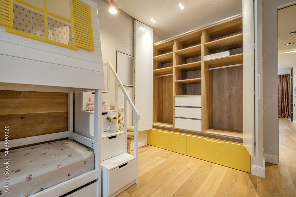 Modern apartment interior in children room with wooden bunk bed Modern apartment interior in children room with wooden bunk bed