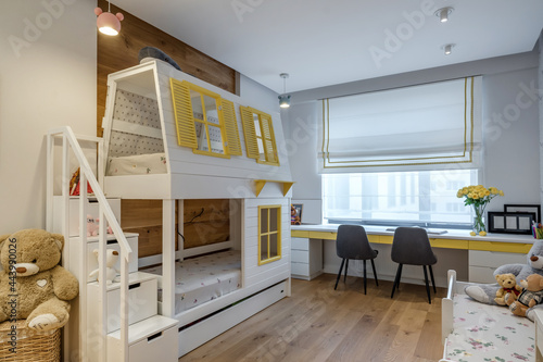 Photos Modern apartment interior in children room  with wooden bunk bed