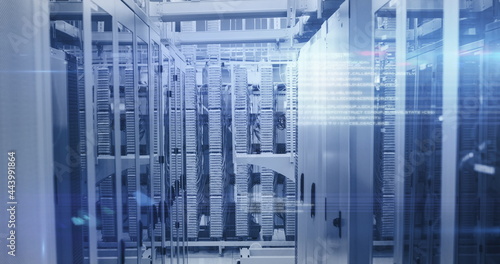 Computer servers in a server room with glowing lights