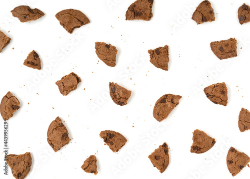 Brown biscuits crumbs isolated on white background.