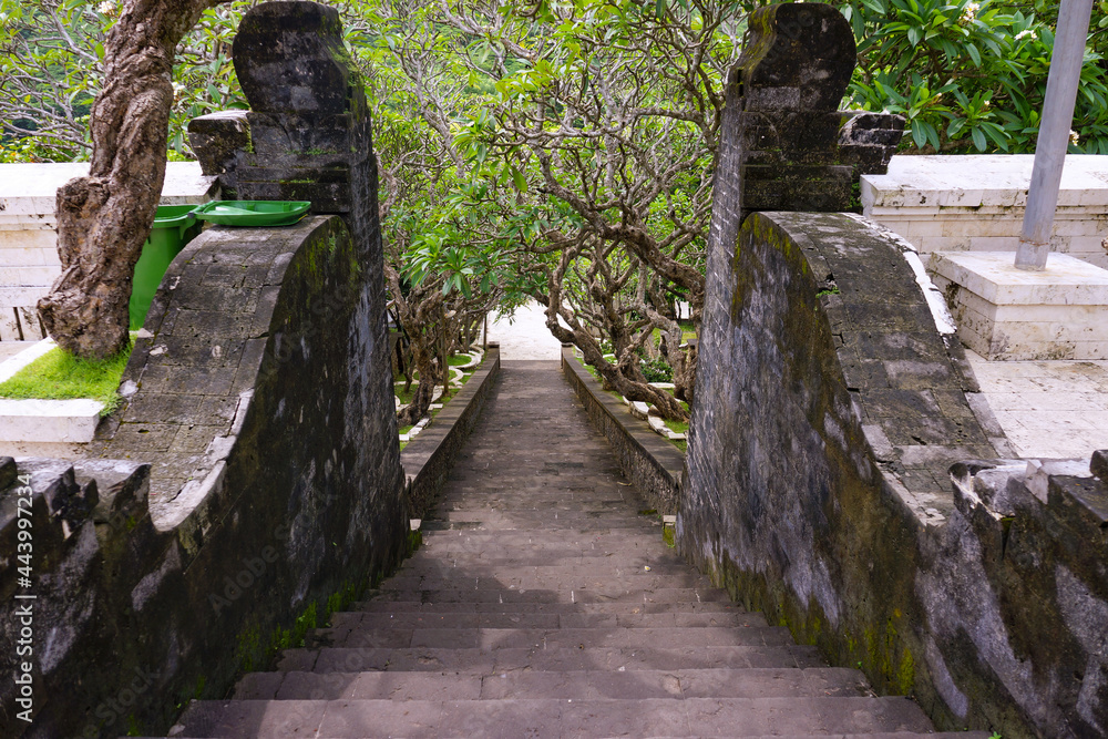 Fototapeta premium Ancient stone stairway at Uluwatu temple in Bali, Indonesia. No people.