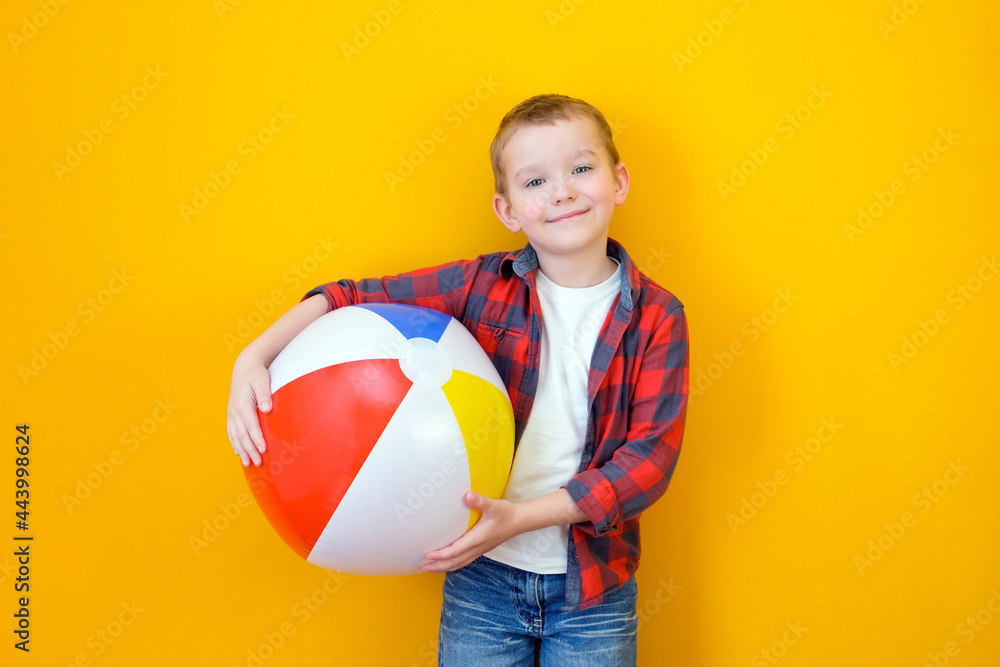 Summer vacation concept, portrait of happy cute little child, boy smiling and holding beach ball, child having fun with inflatable ball, Summer vacation concept, portrait of happy cute little child, boy smiling and holding beach ball, child having fun with inflatable ball,