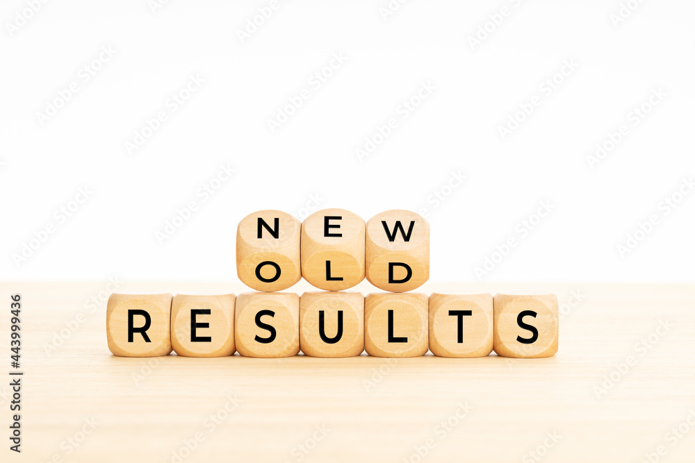 New vs old results symbol in wooden blocks on table. White background. Copy space New vs old results symbol in wooden blocks on table. White background. Copy space