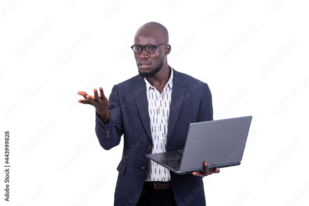 portrait of a young businessman holding laptop, pissed off. portrait of a young businessman holding laptop, pissed off.