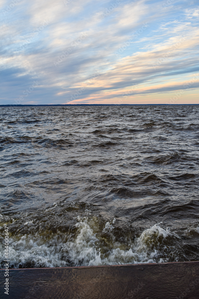 beautiful sunset and waves on the Volga River