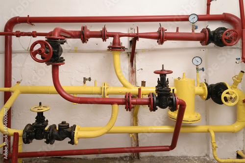 Wallpaper Mural Red and yellow pipes, water supply management system in an industrial building Torontodigital.ca