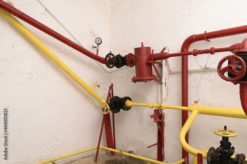 Wallpaper Mural Red and yellow pipes, water supply management system in an industrial building Torontodigital.ca