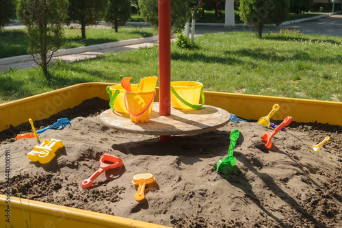 Wallpaper Mural Sandbox in a kindergarten with toys for playing in the sand, with buckets, shovels and molds Torontodigital.ca