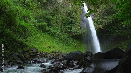 La Fortuna Waterfall, Costa Rica Pan to the right with rocks in front photo