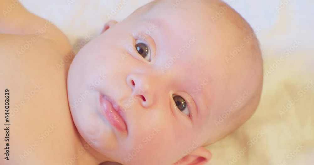portrait of a cute little child lying in bed.close-up. portrait of a cute little child lying in bed.close-up.
