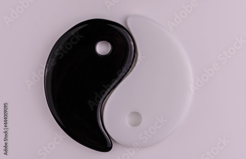 Japanese symbol of masculine and feminine beginning yin yang on a white background. photo