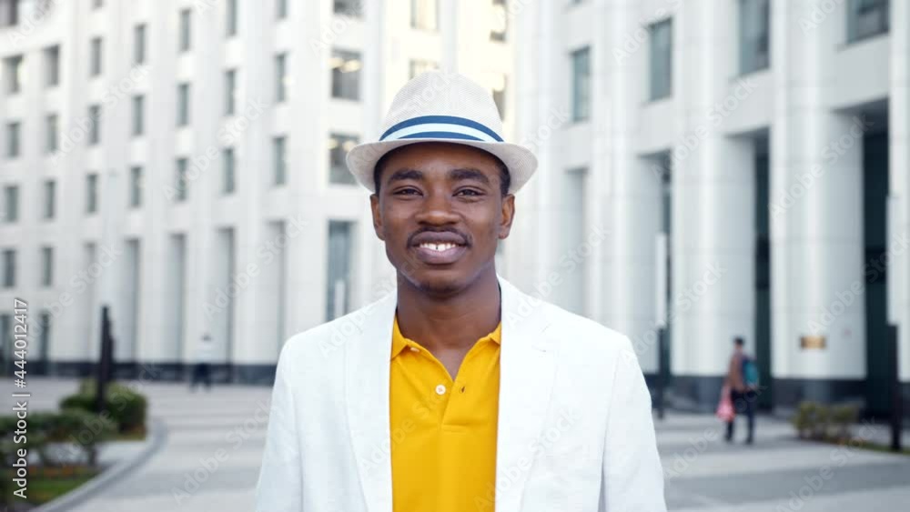 Smiling African American businessman in white fedora hat Smiling African American businessman in white fedora hat
