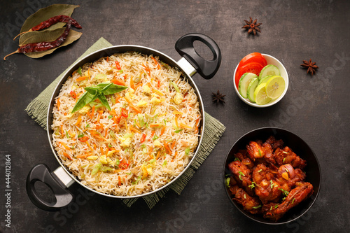 Chinese fried rice and chilly chicken curry Chicken fried rice with vegetables fried eggs basmati grain very popular food in restaurants Kerala Mumbai India Sri Lanka china