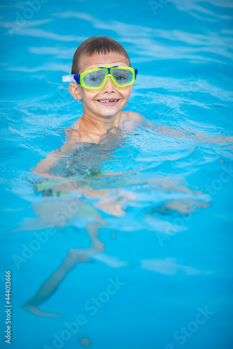 Cute little boy in a swimming pool