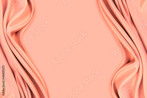 Beautiful elegant wavy light pastel orange peach satin silk luxury cloth fabric texture with monochrome background design. Copy space