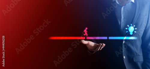Fototapeta Naklejka Na Ścianę i Meble -  Male business man hand hold a connecting block between two sets of bridge road for a silhouetted man to walk idea icon.