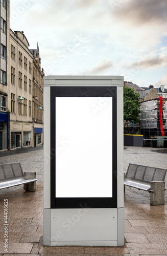 Electronic sign on high street with bright white copy space on blank screen to add message or logo to display for marketing. Advertisement billboard empty frame. 