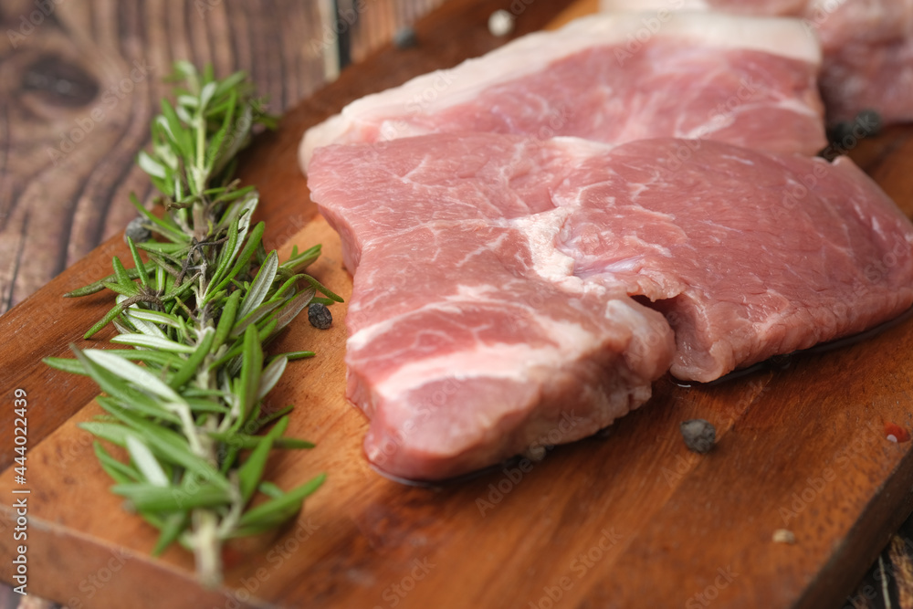 close up of raw meat on chopping board on a chopping board 