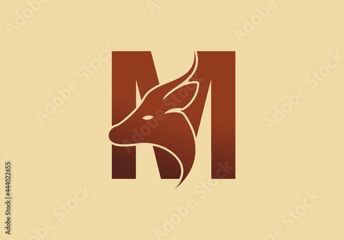 Brown color of M initial letter with deer head