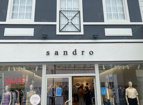 Roermond, Netherlands - July 1. 2021: View on store facade with logo  lettering of sandro french fashion label Stock Photo | Adobe Stock