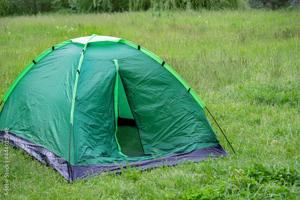 tourist tent, outdoor recreation near the river. Nature, recreation, camping.