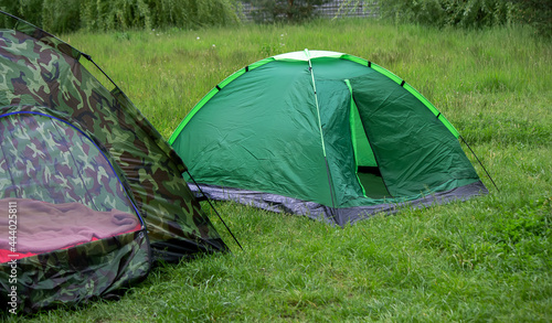 tourist tent, outdoor recreation near the river. Nature, recreation, camping.