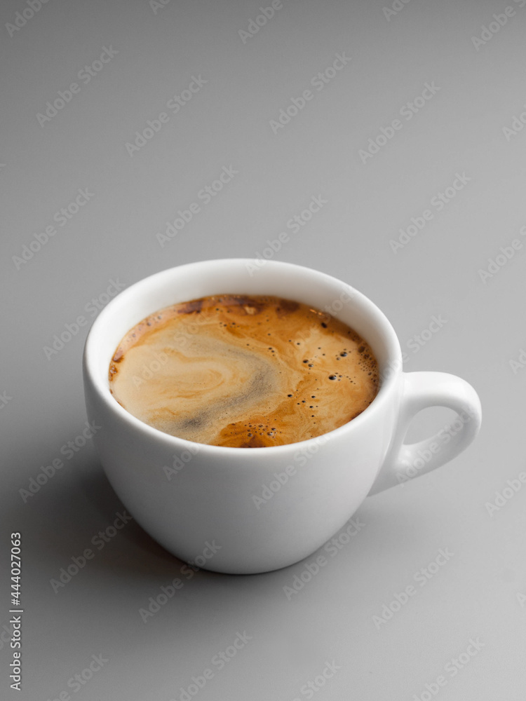 Delicious hot double shot of coffee in a white beautiful cup Delicious hot double shot of coffee in a white beautiful cup