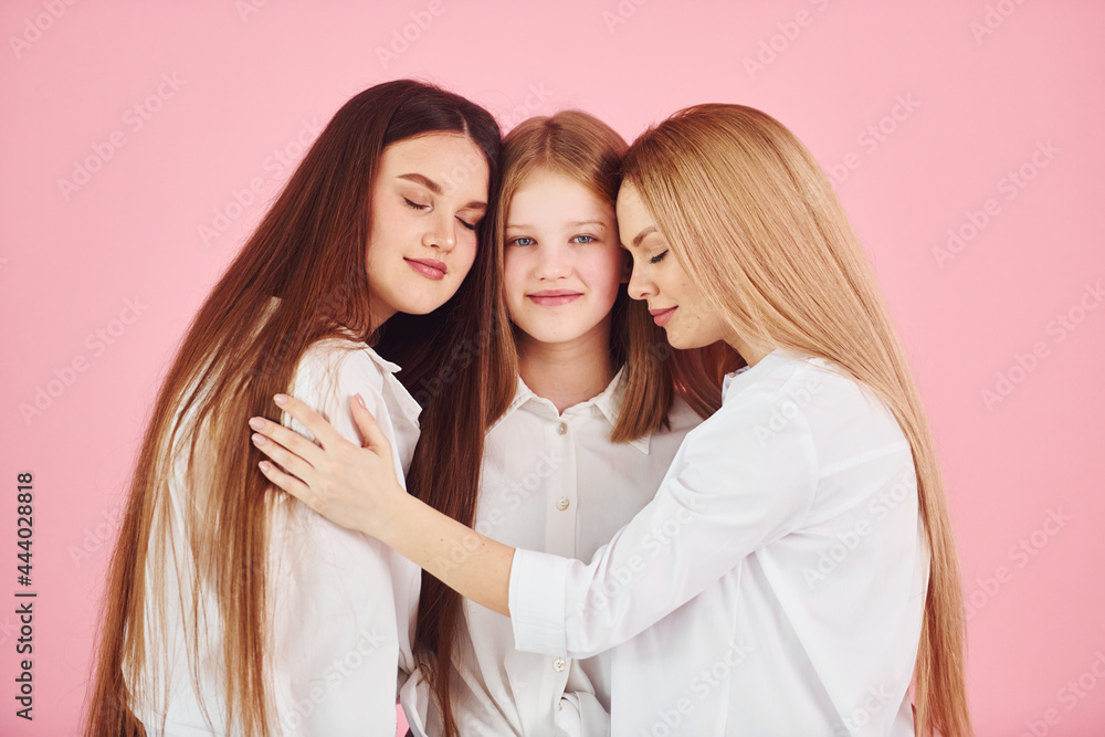 Young mother with her two daughters is in the studio Young mother with her two daughters is in the studio