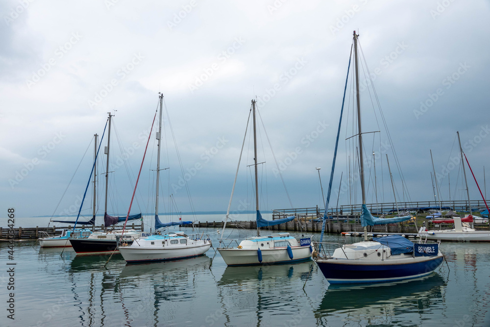 boats moored in the marina on a stormy summer day