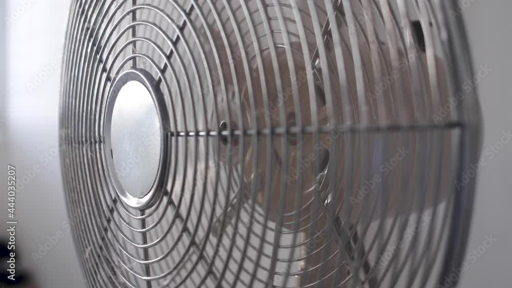 Air fan turned on Close up. of hand switching ON an air fan. High heat