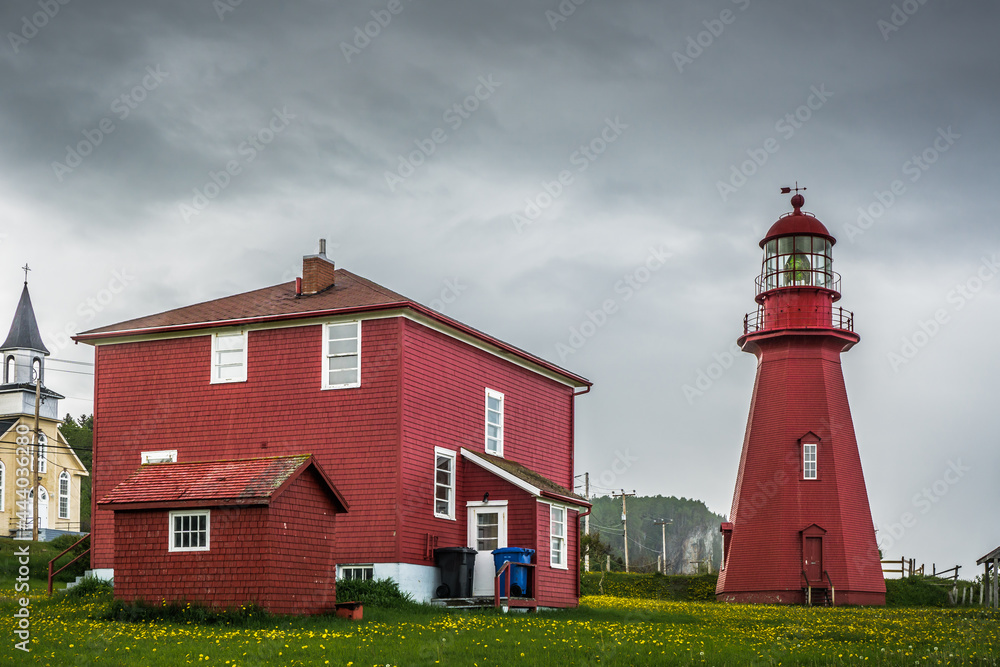 View on the red lighthouse of La Martre, located on the northern shore of the Gaspesie Peninsula in Quebec (Canada)
