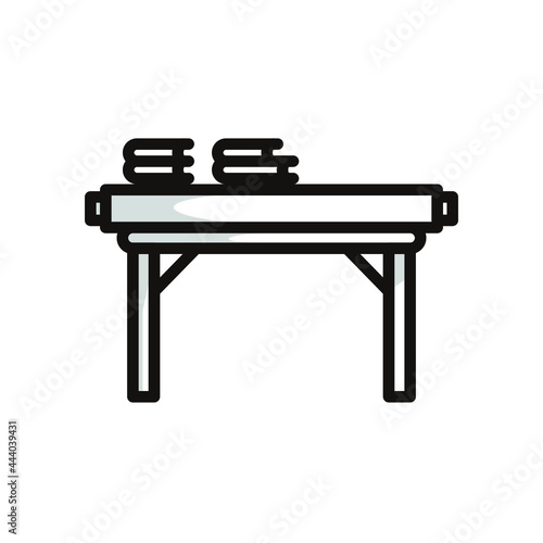 Simple symbol of a study desk, in black line art style and shadow details.